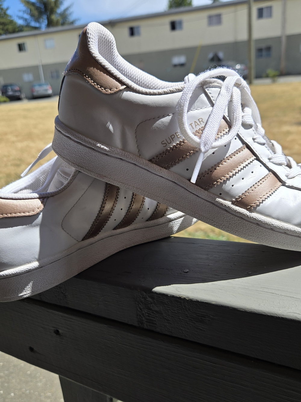 Adidas Super Star Women’s White Sneakers with Metallic Rose Gold Stripes
